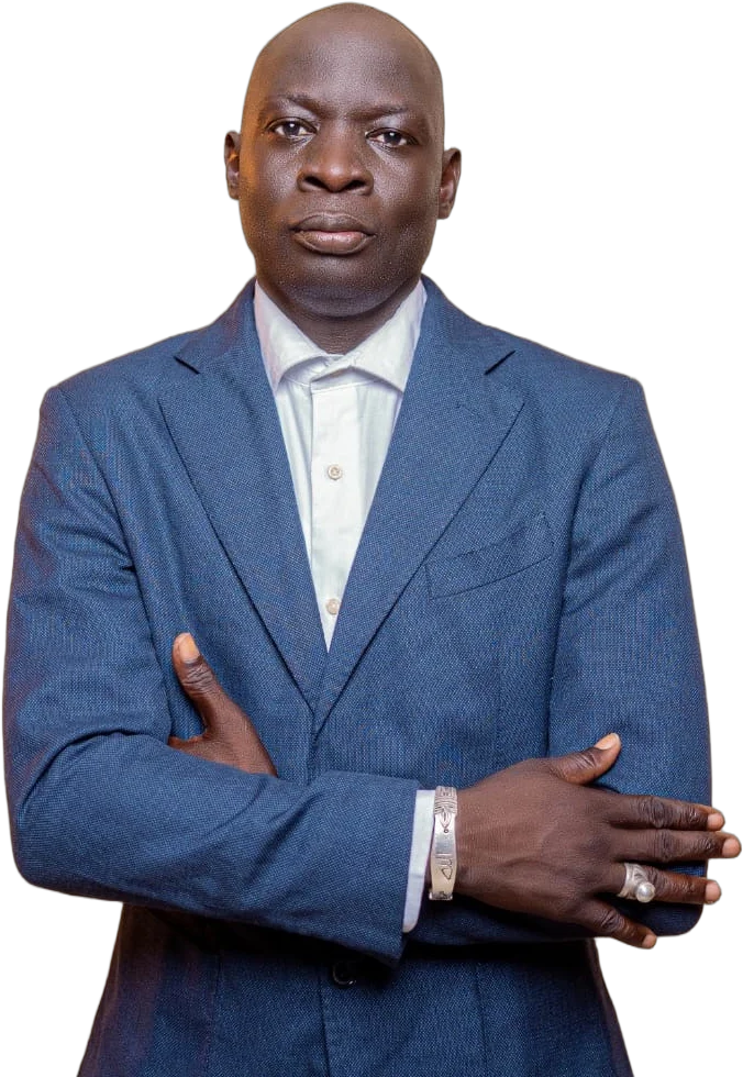 Kebba Madi Bojang in a blue suit, arms folded